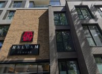 Close-up exterior photo of Hallam Towers showing entrance