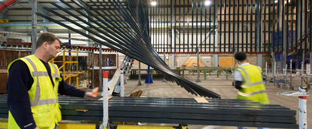 Vertical powder coating lines at the Senior Architectural Systems factory described by RIBA Journal as ‘cathedral-like’