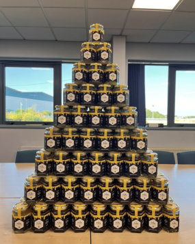Photo of stacked jars of honey harvested from the SAS beehive